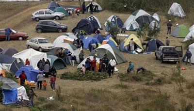 People afraid of a possible tsunami camp in Talcahuano, southern Chile, Sunday, Feb. 28, 2010. An 8.8-magnitude earthquake struck central Chile early Saturday. (AP Photo/Aliosha Marquez)