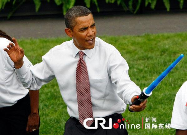 President Barack Obama jokingly attacks Olympic fencer Tim Morehouse during a fencing demonstration on the South Lawn of the White House promoting the city of Chicagos bid for the 2016 Summer Olympics September 16, 2009 in Washington, DC. Obama joined Chicago Mayor Richard Daley, members of the USOC, and representatives from the Chicago2016 group during the event.