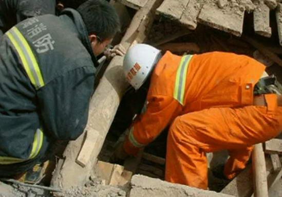 Screen grab from Chinese state CCTV shows rescuers attempting to save a life following a major earthquake in Yushu County, northwest Qinghai province. 