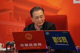 Chinese Premier Wen Jiabao holds an online chat with netizens jointly hosted by the central government websiteand Xinhua website in Beijing, China, Feb. 28, 2009. (Xinhua photo)