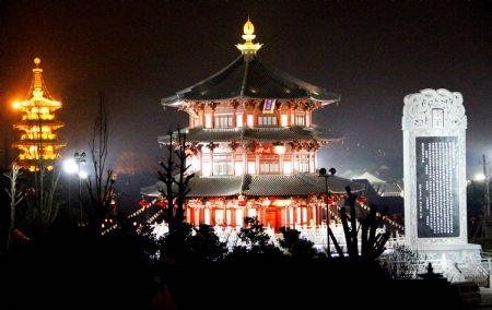 The Giant Bell and Stele Garden outside of the Hanshan Temple flare and scintillate in grand illumination, in Suzhou, east China's Jiangsu Province, Dec. 29, 2009. The bell tower, pagoda, the Giant Bell and Stele Garden and other major scenic spots of the Hanshan Temple are invariably lightened on in an ebullient illumination to usher in the traditional New Year's Eve Bell Ringing activity on the night of Dec 31, as some 6,000 guests and sightseers are set to take part in. (Xinhua/Wang Jianzhong)