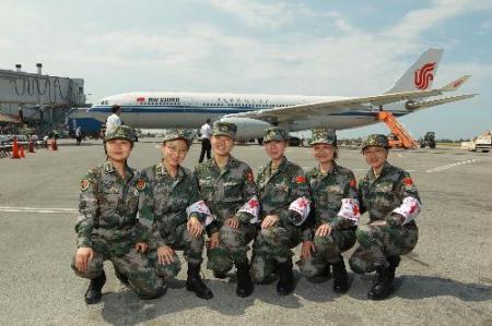 Six female members of the Chinese medical team pose for a group photo before leaving at the international airport in Port-au-Prince, capital of Haiti, Feb. 8, 2010. The Chinese medical team Monday left Port-au-Prince for home after winding up a two-week emergency aid and epidemic control mission in the quake-stricken Caribbean country. During its stay, the team has treated more than 4,000 wounded Haitians and played an important role in the medical and epidemic control efforts in the aftermath of the devastating Jan. 12 quake. 