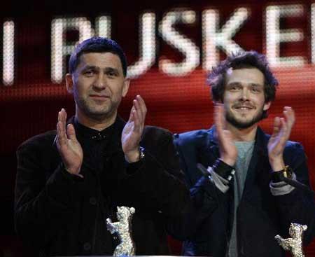 Russian actors Grigory Dobrygin (R) and Sergei Puskepalis applaud after receiving Silver Bears for Best Actor for their roles in "Kak Ya Provel Etim Letom" (How I Ended This Summer) during the awards ceremony of the 60th Berlinale International Film Festival in Berlin on Feb. 20, 2010. (Xinhua/Luo Huanhuan)