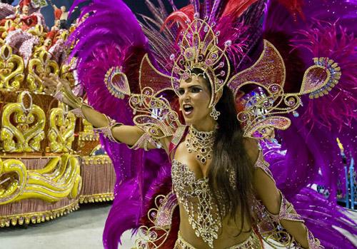 An Academicos do Grande Rio samba school dancer performs down the Sambodrome on the first night of the Carnival samba school parade in Rio de Janeiro. Photo: AFP