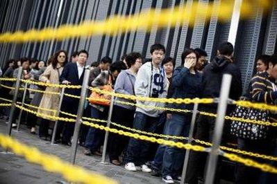 Visitors wait to enter the Shanghai World Expo site April 21, 2010. The expo started trial operations on Tuesday with the participation of about 70 percent of the pavilions, Xinhua News Agency reported. China is the first developing nation to host the World Expo and officials hope the event, held from May 1-Oct 31, will improve Shanghai's position as a global city.REUTERS/Aly Song (CHINA - Tags: SOCIETY BUSINESS)