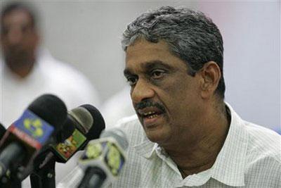 Defeated presidential candidate Sarath Fonseka speaks to the relatives of his supporters, after his supporters were arrested, in Colombo, Sri Lanka, Monday, Feb. 8, 2010. (AP Photo/Chamila Karunarathne)