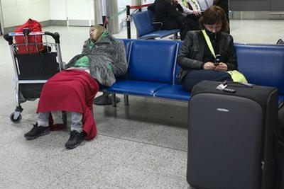 Passengers wait in London's Gatwick Airport, Crawley, England, Friday, April 16, 2010. (AP Photo/Sang Tan)