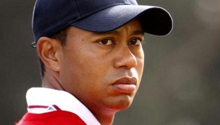 U.S. team member Tiger Woods watches play as he stands on the sixth hole during his foursome match at the Presidents Cup golf tournament at Harding Park golf course in San Francisco, California, in this October 8, 2009 file photo.(Xinhua/Reuters File Photo)