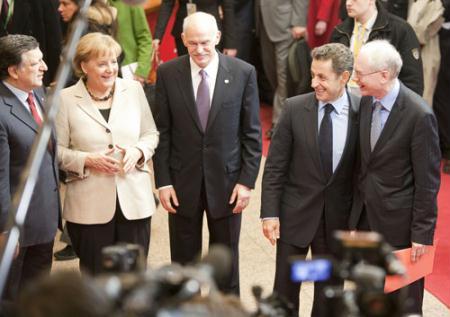 German Chancellor Angela Merkel (Front L), Greek Prime Minister Georgios Papandreou (C) and French President Nicolas Sarkozy (Front R) leave the EU Council building after a meeting in Brussels, capital of Belgium, Feb. 11, 2010. An informal summit of European Union leaders on Thursday, originally called to work on a new economic strategy for the next decade. (Xinhua/Thierry Monasse)