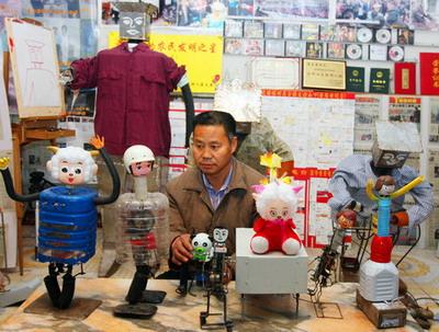 Wu Yulu checks his Expo robots in his workshop in Mawu county, Tongzhou district, Beijing, March 23, 2010. [Photo/CFP]