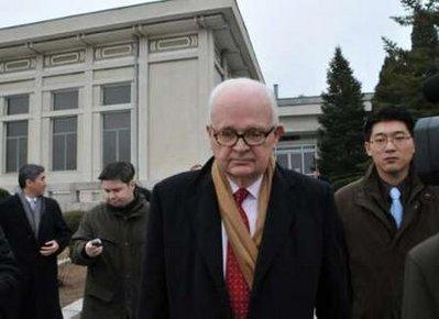 U.S. special envoy Stephen Bosworth (2nd R) is seen at the Sunan Airport before leaving for South Korea, in Pyongyang, December 10, 2009. Bosworth, the first envoy sent by U.S. President Barack Obama to North Korea, ended a three-day trip on Thursday where he said he had a "useful meeting" aimed at bringing Pyongyang back to nuclear disarmament discussions. REUTERS/Xinhua/Yao Ximeng 