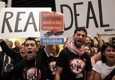 Activists supporting the tiny Pacific island of Tuvalu demonstrate in the main venue demanding a better deal for all island states at the UN Climate summit in Copenhagen, Denmark, Wednesday, Dec. 9, 2009. The Pacific island of Tuvalu has been rebuffed at Copenhagen after demanding strong action to curb global warming.Tuvalu proposed amending the U.N. climate treaty to require the world's nations to keep the rise in temperatures to 1.5 degrees C (2.7 degrees F) above preindustrial levels.(AP Photo/Anja Niedringhaus) 