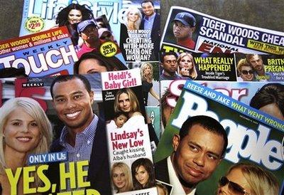 Magazines featuring Tiger Woods are photographed Wednesday, Dec. 2, 2009, in New York. Woods said he let his family down with 'transgressions' he regrets 'with all of my heart,' and that he will deal with his personal life behind closed doors, in a statement released Wednesday.(AP Photo/Julie Jacobson)