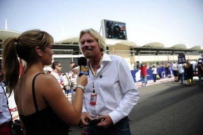 Virgin Group's president and Brawn GP shareholder Richard Branson answers a journalist on the grid of the Sakhir racetrack, before the start of the Bahrain Formula One Grand Prix, in April, in Manama. New Formula One team Manor GP is to be rebranded as Virgin Racing following the announcement of a sponsorship agreement with Sir Richard Branson's business empire.(AFP/File/Fred Dufour)