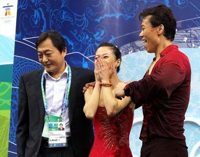 Chinese figure skating coach Yao Bin (L) is coach of both  of the figure skating pairs of Shen Xue, Zhao Hongbo and of Pang Qing, Tong Jian