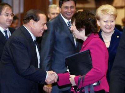 Italy's Prime Minister Silvio Berlusconi (L) greets EU High Representative for Foreign Affairs Catherine Ashton (R) during a two-day European Union leaders summit in Brussels December 10, 2009.REUTERS/Thierry Roge