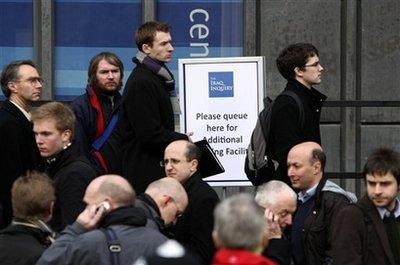 People queue up to enter the Iraq Inquiry in London, Friday, Jan. 29, 2010. Former Prime Minister Tony Blair faced tough questioning Friday on his controversial decision to back the 2003 U.S.-led invasion of Iraq - a pledge that led to widespread protests in Britain and weakened his standing as leader. Blair's testimony is expected to provide the highlight of the Iraq Inquiry, a wide-ranging investigation commissioned by the government to scrutinize the behind-the-scenes machinations that brought Britain into a costly and unpopular war.(AP Photo/Alastair Grant) 