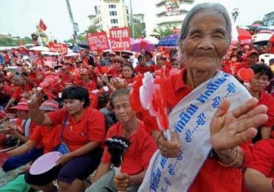 Red-shirted supporters of deposed Thai premier Thaksin Shinawatra shout slogans during an anti-government protest in Bangkok. (AFP/Pornchai Kittiwongsakul)