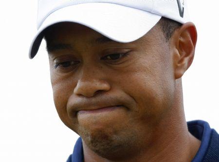 Tiger Woods reacts during the British Open Golf Championship at the Turnberry Golf Club in Scotland, in this July 16, 2009 file photo. Woods said on December 11 he would take an "indefinite break" from professional golf, acknowledging the disappointment and hurt his "infidelity" had caused his family.(Xinhua/Reuters Photo)