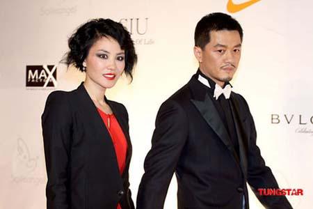 Faye Wong(l) and Li Yapeng arrive at the red carpet of the Yanran Angel Foundation at the Park Hyatt Beijing on December 18, 2009 in Beijing, China.[Tungstar]