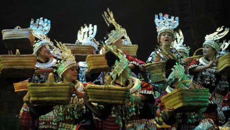 Actors perform a song and dance drama named Yangasha in Guiyang, capital of southwest China's Guizhou Province, on Dec. 27, 2009. The drama was rearranged from an old narrative poem of Miao ethnic group "Maiden Yangasha", which was honored as "the most beautiful song of Miao ethnic group". (Xinhua/Ou Dongqu)