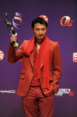 Hong Kong actor Nicholas Tse poses with his trophy at the backstage after winning the Best Supporting Actor for his role in the movie "Bodyguards and Assassins" at the 29th Hong Kong Film Awards held in Hong Kong, south China, April 18, 2010. (Xinhua Photo)