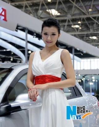 A model poses at 2010 Beijing International Automotive Exhibition on April 23, 2010. The auto exhibition kicked off Wednesday at China International Exhibition Center in Beijing. (Xinhuanet Photo