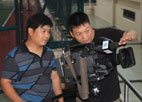 編導李超攝像王戰勝在駐港部隊拍攝