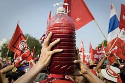 A supporter of deposed Thai premier Thaksin Shinawatra holds a bottle containing human blood during a demonstration in Bangkok. (AFP/Nicolas Asfouri)