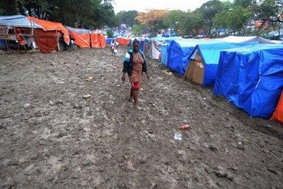 Rain turns the streets of a tent city into mud on March 6 in Port-au-Prince. Haiti has unveiled the first draft of its grand reconstruction plan, saying 11.5 billion dollars would be needed to help the country rebuild after January's devastating earthquake. (AFP/File/Thony Belizaire) 