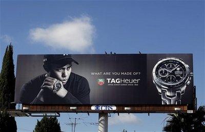 A billboard for Tag Heuer watches featuring golfer Tiger Woods is seen in Los Angeles on Monday, Dec. 14, 2009. The self-destruction of Tiger Inc. is calling into question whether companies can afford the risk of signing multimillion-dollar contracts with celebrity endorsers.(AP Photo/Damian Dovarganes)