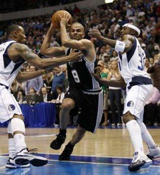 San Antonio Spurs guard Tony Parker (C) drives between Dallas Mavericks forward Caron Butler (L) and guard Jason Terry during the second half of Game 1 of their NBA Western Conference playoff series in Dallas, Texas April 18, 2010.« Read less REUTERS/Mike Stone (UNITED STATES - Tags: SPORT BASKETBALL)