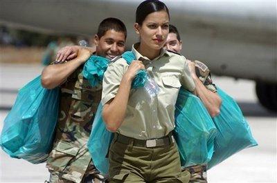 Police unload international aid for earthquake victims at the international airport in Santiago, Sunday, March 7, 2010. An 8.8-magnitude earthquake struck central Chile on Feb. 27, causing widespread damage.(AP Photo/Carlos Espinoza)