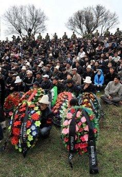 Kyrgyz people attend mass burials at the Ata-Beyit memorial complex outskirts of Bishkek. The United States has started sending aid to Kyrgyzstan after the unrest this week in which scores were killed and saw the opposition seize control of the Central Asian nation, the US embassy said Saturday.(AFP/Vyacheslav Oseledko)