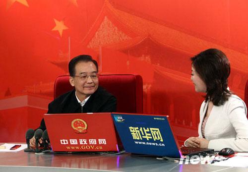 Chinese Premier Wen Jiabao (L) chats on-line with netizens at two state news portals in Beijing, capital of China, Feb. 27, 2010. The two major portals, namely www.gov.cn of the central government, and www.xinhuanet.com of Xinhua News Agency, jointly interviewed Premier Wen on Saturday with chosen questions raised by netizens. (Xinhua/Liu Weibing)