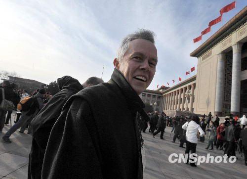 The United States Ambassador to China, Jon M. Huntsman Jr., walks towards the Great Hall of the People, where China's National People's Congress (NPC) - the country's parliament - started its annual full session in Beijing Friday morning. Some ambassadors to China have attended the opening ceremony and listened to Premier Wen Jiabao's government work report.