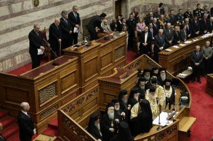 Karolos Papoulias (2nd L, above) is sworn in for a second term as president of the Greek Republic in Athens, capital of Greece, March 12, 2010. He called on all Greeks to jointly deal with the cash-strapped country's economic woes. Papoulias won a second five-year term after capturing 266 votes in the 300-member parliament in an election on Feb. 3.(Xinhua/Marios Lolos)