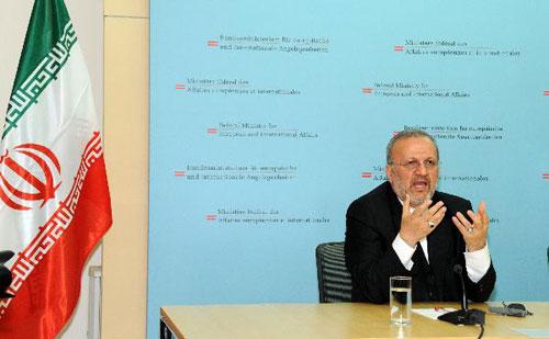 Iranian Foreign Minister Manouchehr Mottaki speaks during a joint press conference with his Austrian counterpart Michael Spindelegger (not pictured) in Vienna April 25, 2010. (Xinhua/Liu Gang)