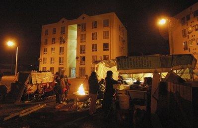 People stand in a camp outside their buildings shortly after a 6.7-magnitude aftershock in Concepcion, Chile, Monday, March 15, 2010. Aftershocks rocked the country on Monday night, in the aftermath of the Feb. 27 earthquake which was the fifth-strongest since 1900. (AP Photo/Ignacio Vasquez) 