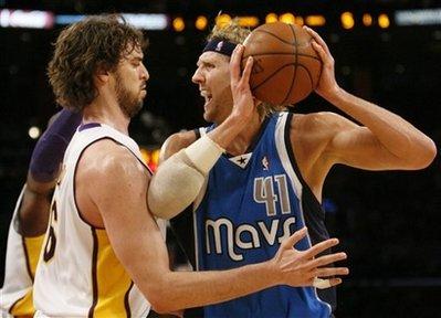 Dallas Mavericks' Dirk Nowitzki, right, of Germany, fronts Los Angeles Lakers' Pau Gasol, left, of Spain, during the first half of an NBA basketball game in Los Angeles on Sunday, Jan. 3, 2010.(AP Photo/Danny Moloshok)