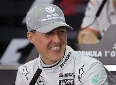 Mercedes Grand Prix driver Michael Schumacher of Germany smiles during a news conference at the Formula One Bahrain International Circuit in Sakhir, Bahrain, Thursday, March 11, 2010.(AP Photo/Hasan Jamali)