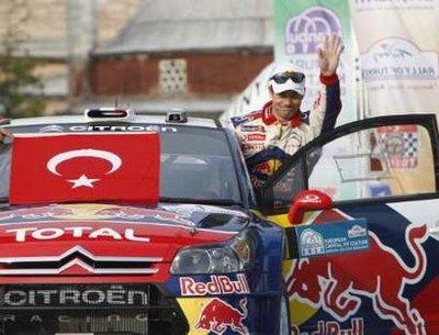 Sebastien Loeb of France on his Citroen C4 WRC waves to fans during the start of the FIA World Rally Championship Turkey Rally in Istanbul April 15, 2010.REUTERS/Osman Orsal (TURKEY - Tags: SPORT MOTOR RACING)
