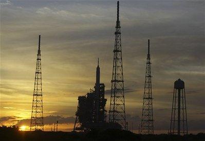 The sun sets on the Ares I-X rocket Monday, Oct. 26, 2009, at Kennedy Space Center's Launch Pad 39-B in Cape Canaveral, Fla. NASA plans a sub-orbital test flight of the rocket early Tuesday morning.(AP Photo/John Raoux)