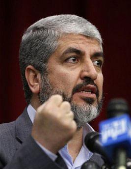 Leader of the Palestinian militant group Hamas, Khaled Mashaal, clenches his fist, as he speaks to the media during a press conference, in Tehran, Iran, Tuesday, Dec. 15, 2009.(AP Photo/Vahid Salemi)