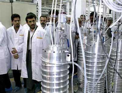 Iranian President Mahmoud Ahmadinejad (2nd L) visits the Natanz nuclear enrichment facility, 350 km (217 miles) south of Tehran, April 8, 2008. REUTERS/Files