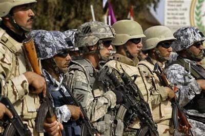 Members of the newly-minted Combined Security Force, which includes Iraqi, Kurdish and American security forces, stand in formation at a graduation ceremony in Kirkuk, north of Baghdad, Iraq, Monday, Feb. 15, 2010. (AP Photo/Maya Alleruzzo)