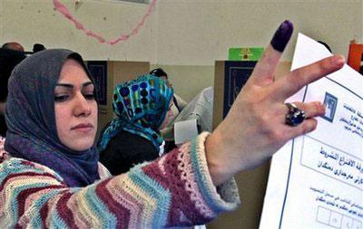 An Iraqi woman casts her ballot at a polling center for the Iraqi elections, in Amman, Jordan, Sunday, March 7, 2010. (AP Photo / Mohammad Abu Ghosh)