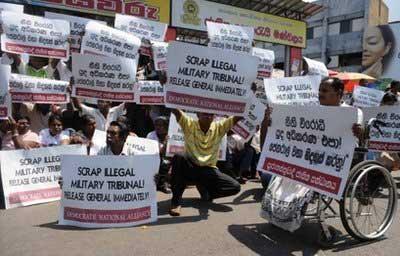 Activists protest against the military detention of former Army chief turned opposition leader Sarath Fonseka in Colombo on March 15. (AFP/Lakruwan Wanniarachchi)