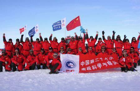 Some members of China's expedition team pose for the photo before their journey in Zhongshan station, Antarctica, Dec. 18, 2009. China's expedition team sent two teams to the inland of Antarctica on Friday. One team headed to China's Kunlun Station, the other one went to the Grove Mountains. (Xinhua/Zhu Bing)