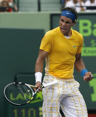 Spain's Rafael Nadal celebrates winning a point against Argentina's David Nalbandian during their match at the Sony Ericsson Open tennis tournament in Key Biscayne, Florida, March 28, 2010.(Xinhua/Reuters Photo)